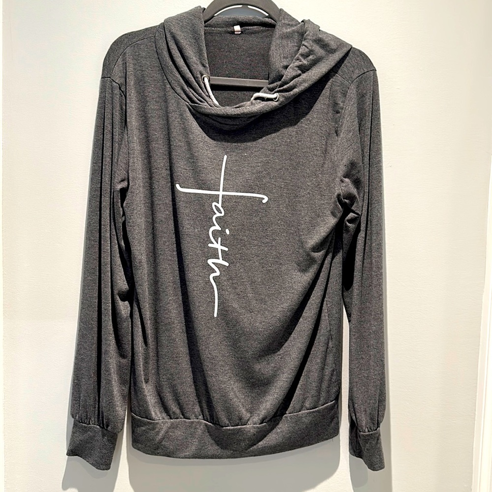 Adorable Faith long sleeve shirt with hood.